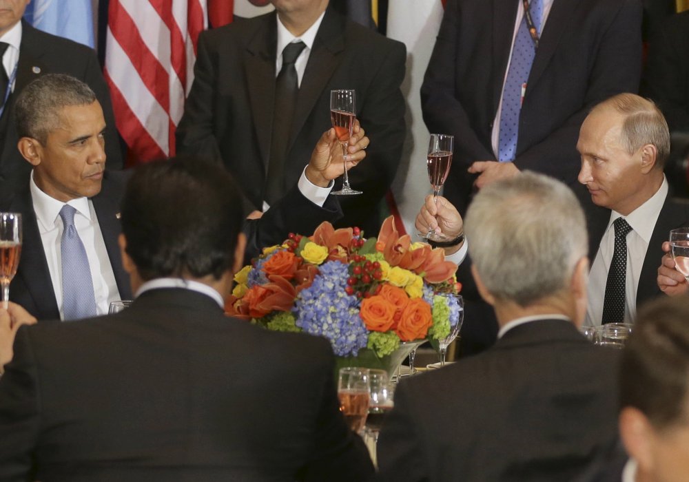 Обама и Путин на обеде в Генассамблее ООН. © Reuters