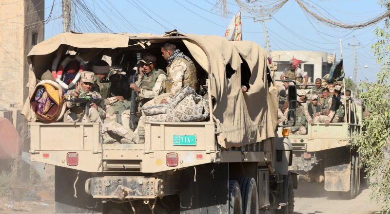 Иракскские военнослужащие на юго-востоке Мосула. REUTERS/Alaa Al-Marjani
