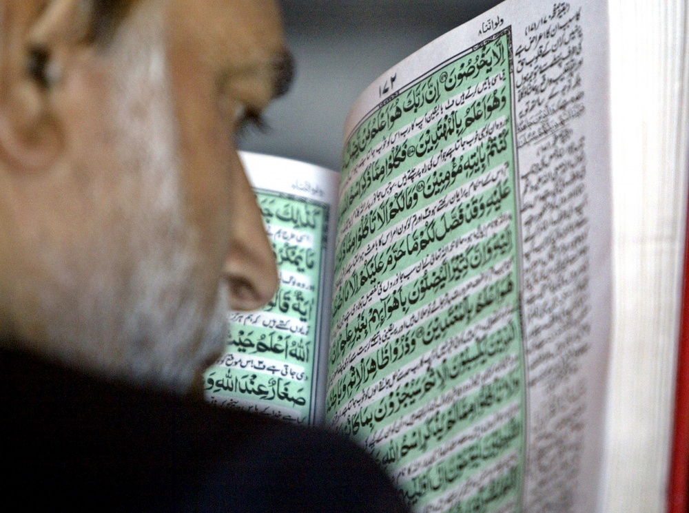 Чтение Корана. ©REUTERS