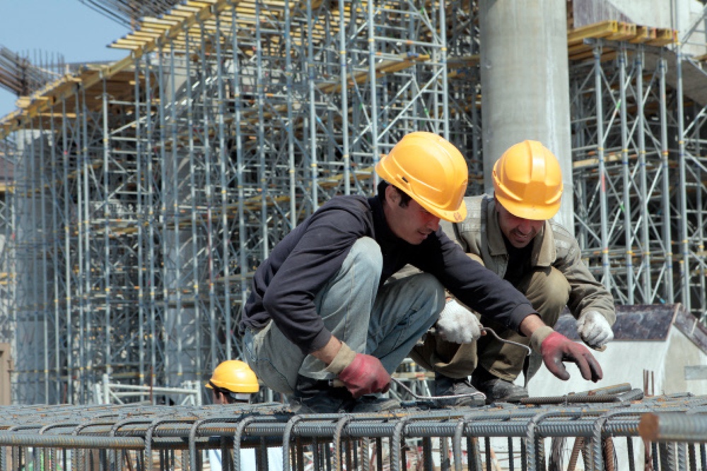 Строители на строительной площадке. Фото РИА Новости©