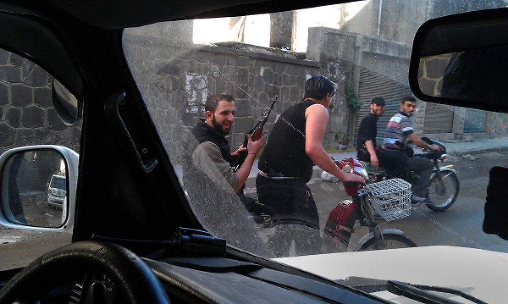 Район аль Халидия города Хомс, контролируемый бойцами Свободной армии. Съемка камерой мобильного телефона. Фото ©РИА Новости