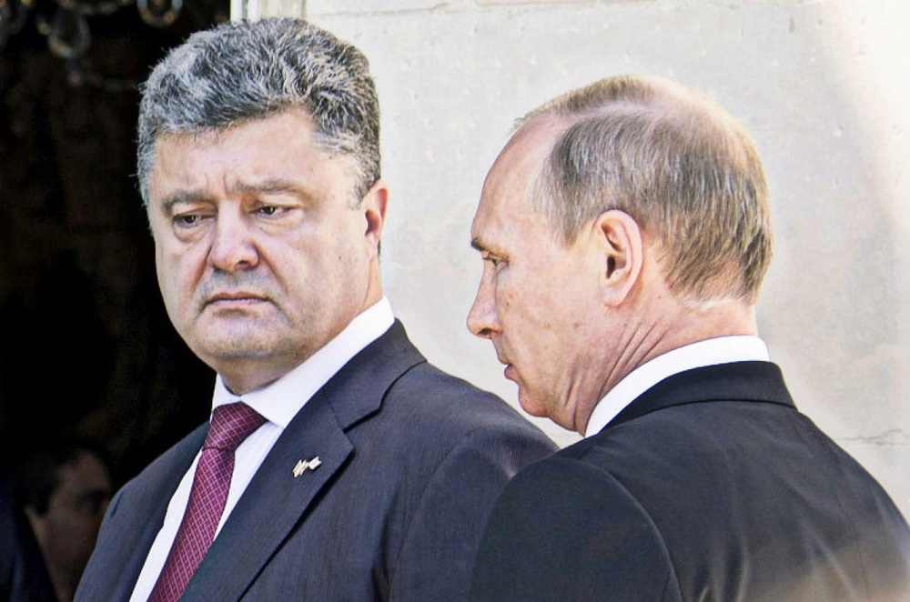 Петр Порошенко и Владимир Путин. Фото с сайта bundeskanzlerin.de