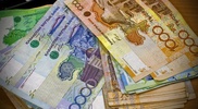 Курс доллара к тенге продолжит медленно расти - эксперт