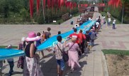 70-метровую ленту Победы пронесли по центральным улицам Шымкента