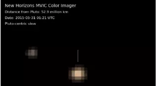 NASA представило первые цветные изображения Плутона и его спутника