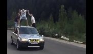 Трое парней прокатились верхом на авто в Алматы