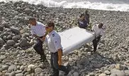 Эксперты приступили к изучению обломков пропавшего малайзийского самолета