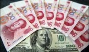 Центробанк Китая после трех дней снижения незначительно повысил курс юаня