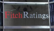 Выгоды от понижения курса тенге могут быть ограниченными - Fitch