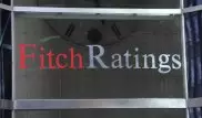 Выгоды от понижения курса тенге могут быть ограниченными - Fitch