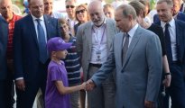 Владимир Путин и 11-летний Денис. © ria.ru