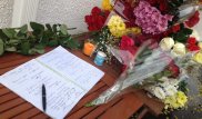 Казахстанцы несут цветы к посольству и консульству Франции