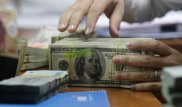Глава Нацбанка успокоил казахстанцев по поводу долларовых депозитов