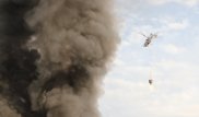 К тушению пожара на барахолке в Алматы привлекли вертолет