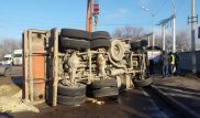 Груженый "КамАЗ" столкнулся с Lada и перевернулся в Алматы