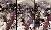 Школьники устроили грандиозный дождь из тетрадей и прокатились по ним