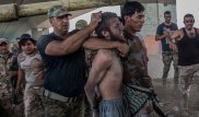 Полуголых боевиков ДАИШ протащили по улицам Мосула