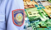 В Алматинской области полицейский брал взятки с подчиненных за опоздание на работу