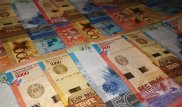 Тенге ослаб в конце недели