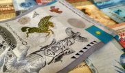 Тенге укрепился до 375 за доллар на бирже