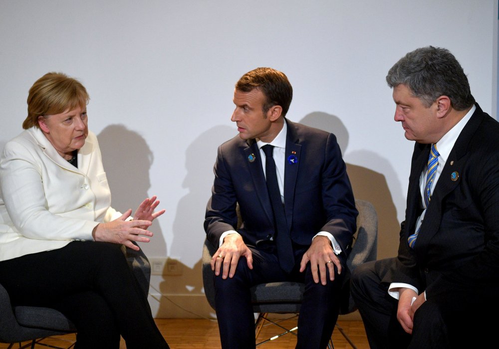 Ангела Меркель, Эммануэль Макрон и Петр Порошенко. © Reuters