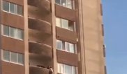 Полицейский спас парня, повисшего на краю 17 этажа в Алматы