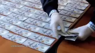 Миллионы тенге и десятки тысяч долларов. Видео задержания 20 таможенников опубликовал КНБ