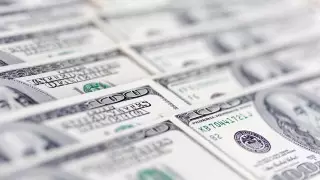 Официальный курс доллара вырос почти на 2 тенге