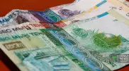 С 1 февраля в Казахстане перестанут принимать банкноты "с рукой"