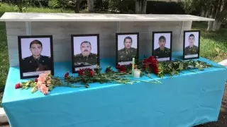 Люди несут цветы в пожарную часть в Жамбылской области