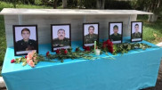 Люди несут цветы в пожарную часть в Жамбылской области