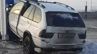 BMW врезался в легковушку и протаранил заправку в Караганде