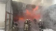 В Алматы горит склад рядом с барахолкой