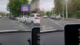 Автолюбители Астаны "облюбовали" одну из полос движения под стоянку. Видео