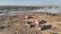 В Астане продолжают тушить пожар на свалке
