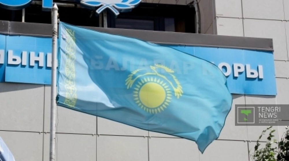 Kazakhstan flag hangs upside down next to UNICEF office in Astana