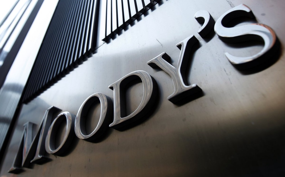Euro under pressure as Moody's lowers Italy bond rating 