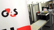 Olympic security firm expects $77 million loss 