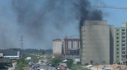 Gunfire in Almaty multi-storey building; smoke from windows