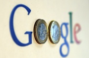 Google shares top $800 despite Microsoft challenge 