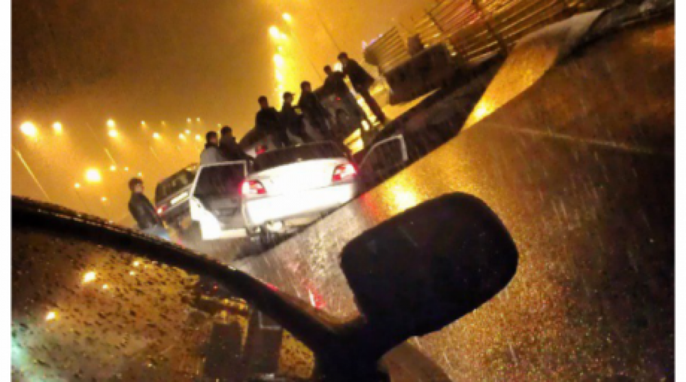 Car slumps under pavement in Almaty