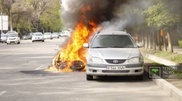 Burning bike smashes into car in Almaty
