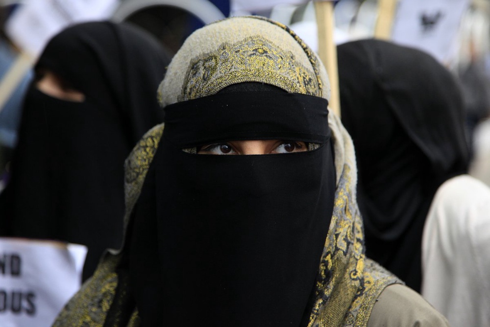 Police check of veiled woman sparks clashes near Paris 