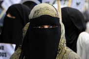 Police check of veiled woman sparks clashes near Paris 