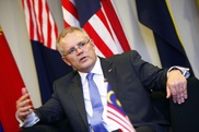 Six hurt as Australia breaks up immigration camp protest