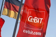 Under shadow of spy scandal, Merkel, Cameron head to tech fair