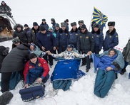 American, two Russians back on Earth after half-year in space