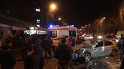 Car crashes into kiosk with woman sleeping inside