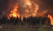 Canadian city evacuated as huge blaze engulfs homes