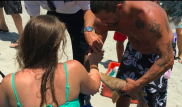 US woman rushed to hospital with shark stuck to arm